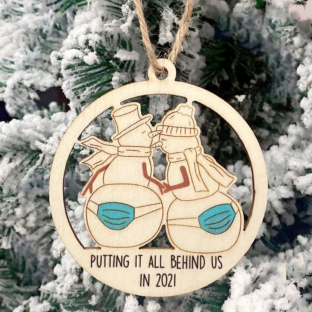 Laser-cut wooden Christmas tree pendant with lovers, snowman, and deer designs