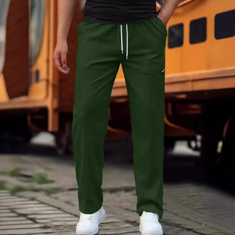 Men's trousers in polyester fabric with elasticated waistband for spring and autumn wear, available in multiple colours including light grey, dark green, black, dark grey and dark blue, with sizing from S to XXXL for a comfortable casual fit