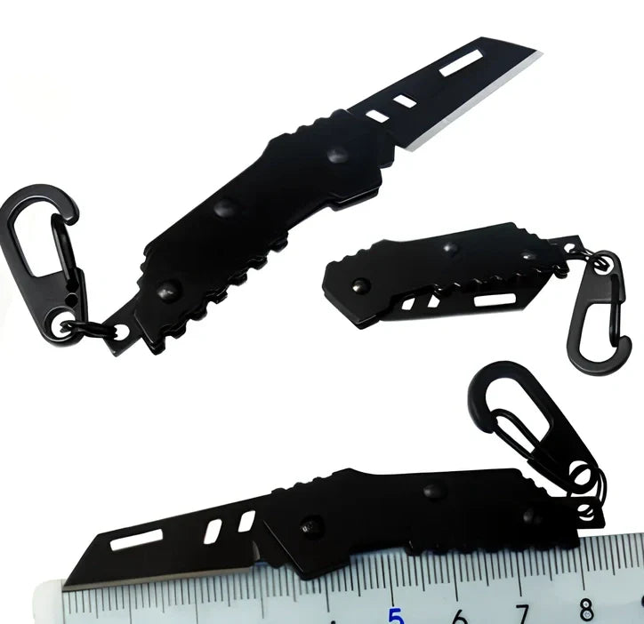 Black pocket folding knife with serrated blade, shown open at 85mm length and closed at 5mm thickness