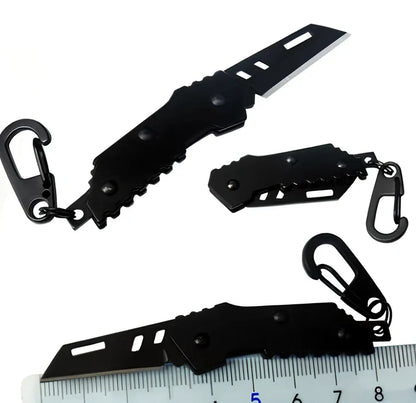 Black pocket folding knife with serrated blade, shown open at 85mm length and closed at 5mm thickness