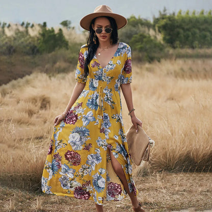 Floral summer beach dress with V-neck, elastic waist, and large hemline in mid-length design