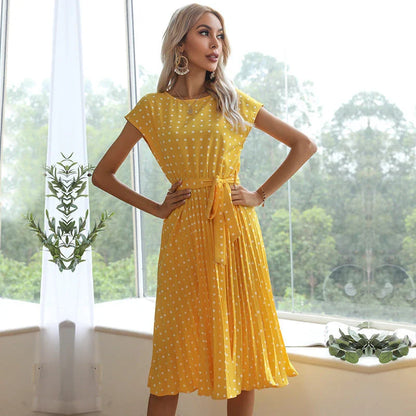 A classic polka dot midi dress with a buttoned style, perfect for summertime