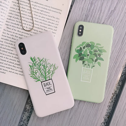 White silicone iPhone case with a painted green leaf plant design on the back.