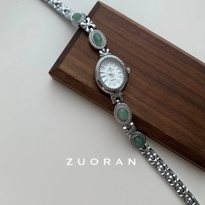 Green jade and silver ladies watch with white dial showing modern Chinese design