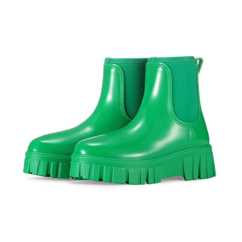 Women's creamy-white low tube PVC rain boots with a flat heel and thickening sole, shown from the side.