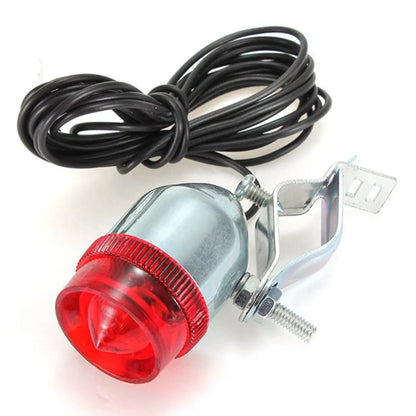 Silver dynamo-powered bicycle light set with generator unit for friction drive on wheel.