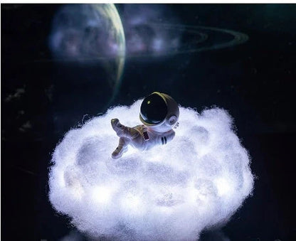 Enchanting cloud-inspired astronaut lamp with a rainbow-like glow, creating a mesmerising and whimsical atmosphere.