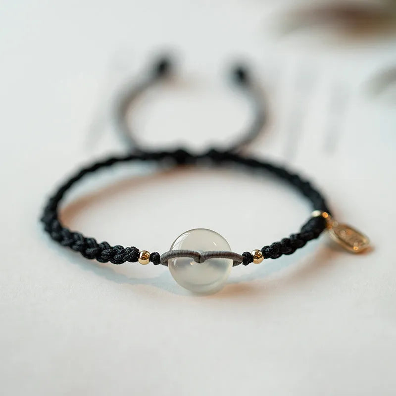 Ethnic style crystal bracelet with vintage woven strap and chamfered square grain details