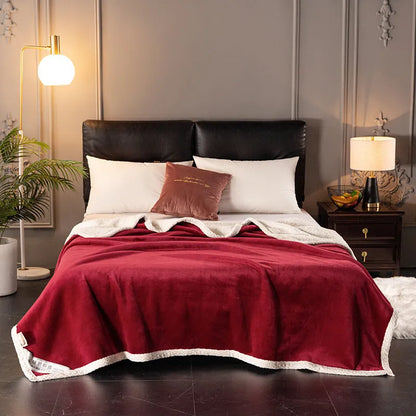 A thick, plain coral fleece blanket in a choice of colours, folded to show its texture.