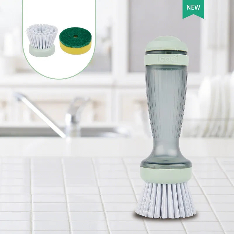 Milk white and mint green pot scrub brush with a soap dispenser handle and replaceable non-scratch bristles.