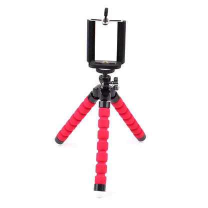 Mini flexible octopus tripod stand with sponge grip holding a smartphone.