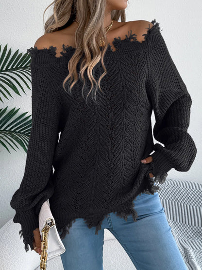 Women's black off-the-shoulder pullover sweater with hollow-out long sleeves on a hanger.