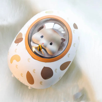 White Hamster space capsule design hand warmer and 5000mAh USB power bank unit.