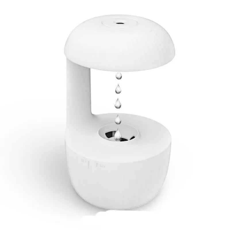 White anti-gravity humidifier showing water droplets appearing to levitate upwards from its base