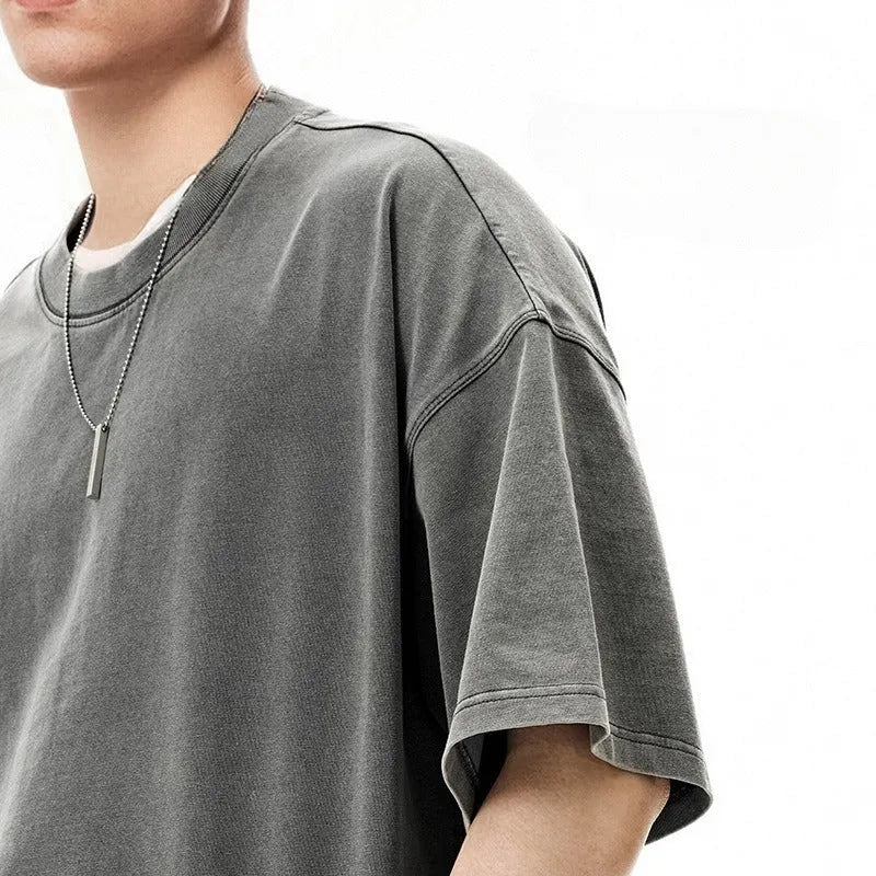 Men's vintage cotton t-shirt with loose fit, drop-shoulder sleeves, and washed-out finish in khaki light colour