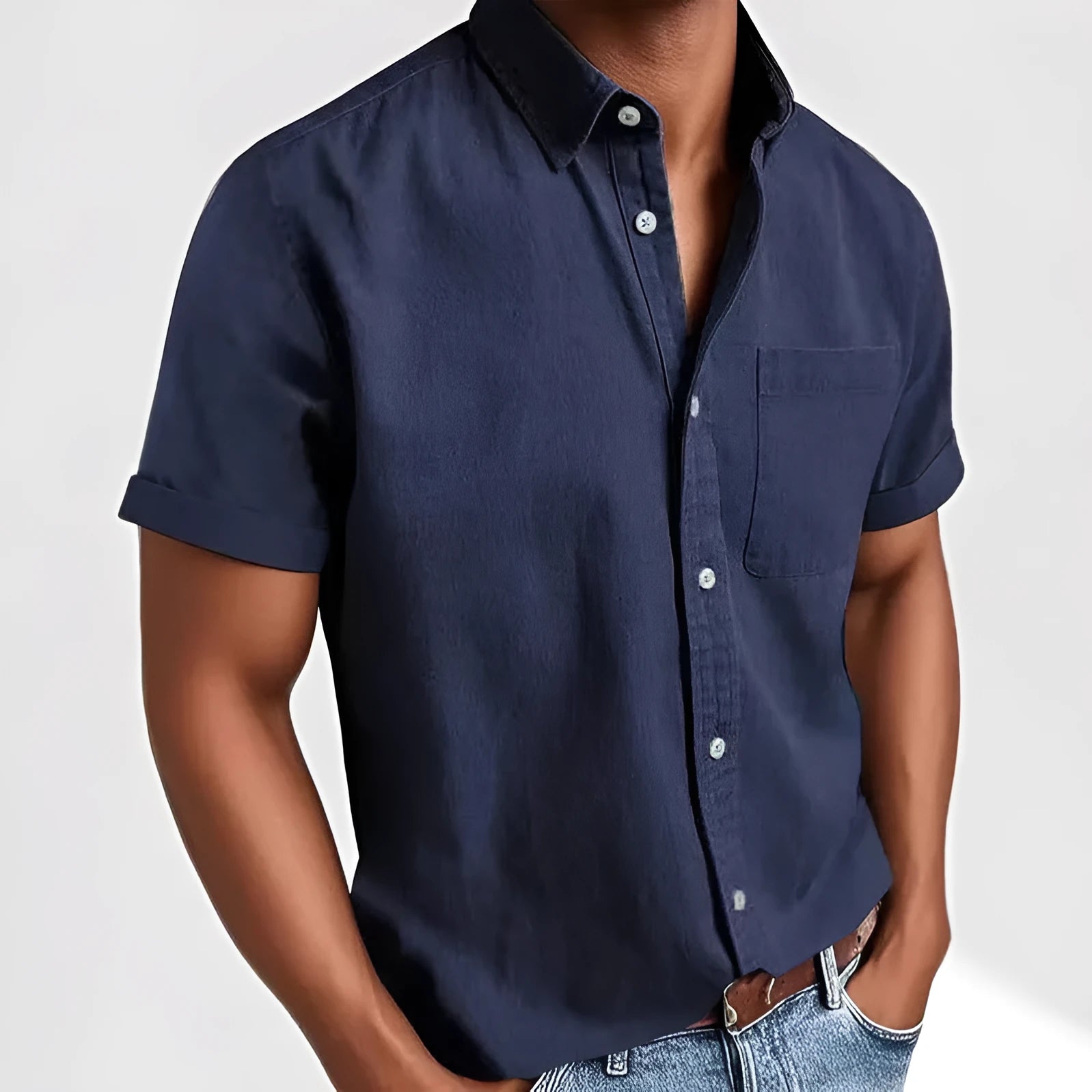 Man wearing a grey loose-fit short sleeve cardigan style shirt