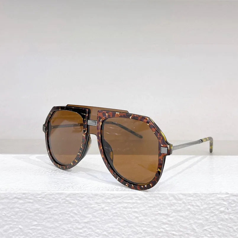 Women's fashion sunglasses with black leopard print pattern on large elliptical frame