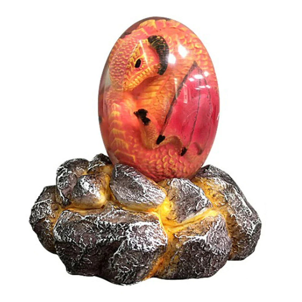 A lifelike resin dragon egg ornament with a crystal-clear, transparent design, sitting on a glowing lava-style base.