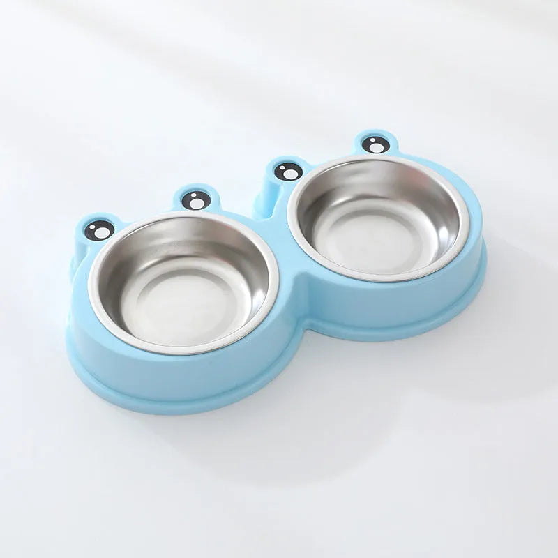 Stainless steel pet bowl with frog design and two compartments for food and water.