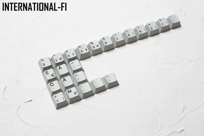 Wired keyboard with international symbol keycaps for ten European language layouts showing USB and PS/2 connections