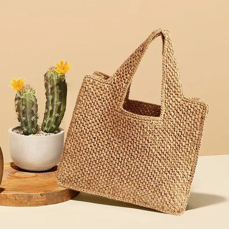 Woven straw tote bag in horizontal square shape with double shoulder straps measuring 40x36x12cm