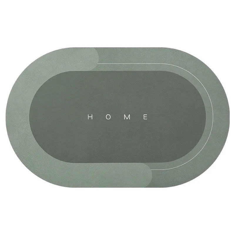 Oval diatomite bathroom floor mat in blue with natural rubber non-slip backing on tiled floor.