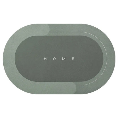 Oval diatomite bathroom floor mat in blue with natural rubber non-slip backing on tiled floor.