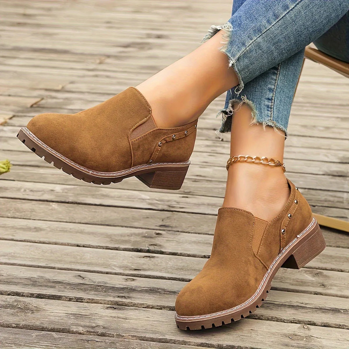 Light brown plus size women's suede ankle boot with low thick heel and elastic band detail.