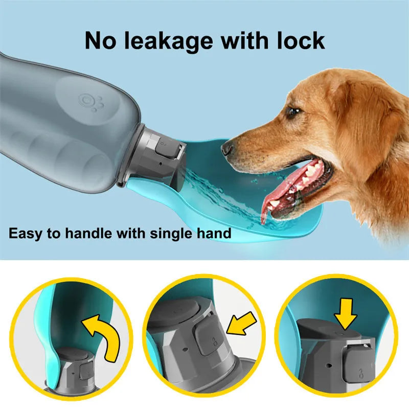 Blue grey portable dog water bottle with fold-out drinking bowl, shown with a wrist strap.