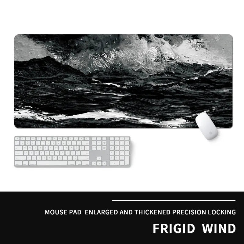 Oversized rectangular mouse pad with a printed design on a desk, next to a keyboard and mouse.
