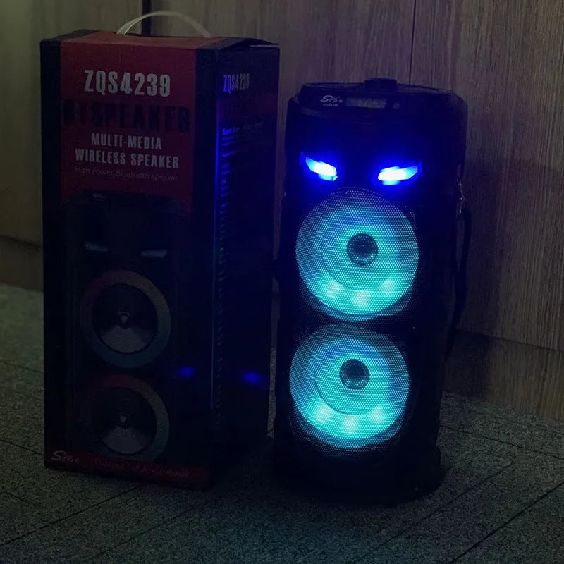 Black portable Bluetooth speaker with dual horn cannon design and wheat-coloured elements
