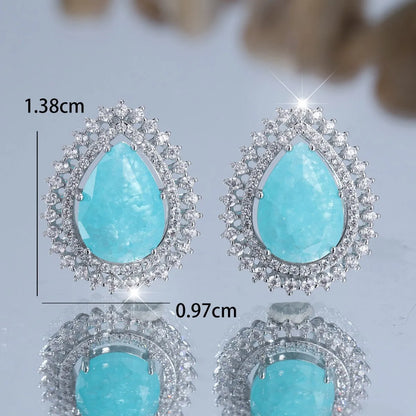 A pair of women's heart-shaped earrings with a platinum ice flower diamond colour finish.