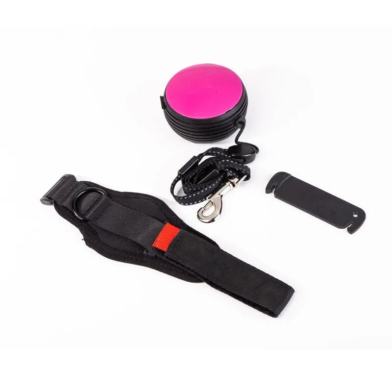 Retractable dog leash with handle and nylon cord in vibrant orange colour, extended to 3 metres.