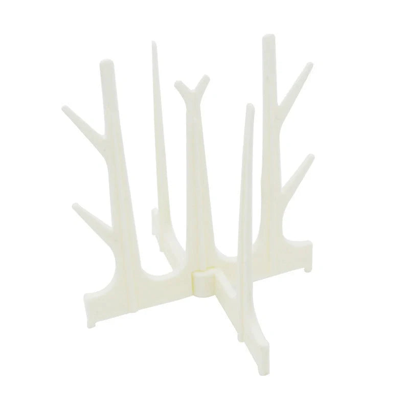 Creative Tree Branch Bottle Drying Rack for baby feeding bottles and accessories in blue, yellow, white, and nude