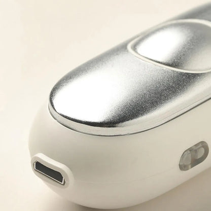 Hand-held micro-current sleep aid device in grey, green, or orange with round button and USB charging port