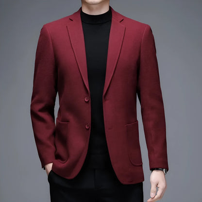 Man wearing a solid colour loose-fit suit-style winter jacket.