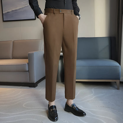 Straight-leg brown corduroy trousers with elastic waistband on size chart