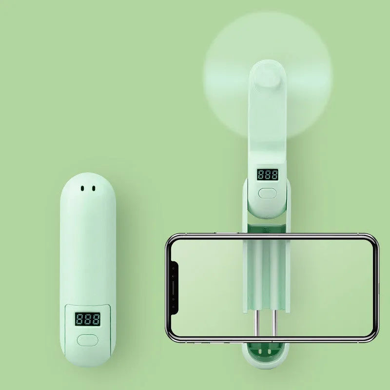 Folding mini fan in green, pink, or white with collapsible design and USB charging port