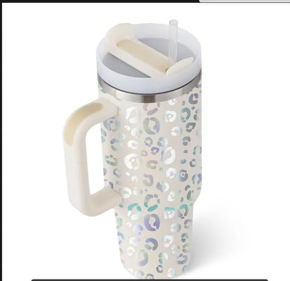 40oz stainless steel tumbler with handle and straw in various colour options showing tapered shape and spill-proof lid