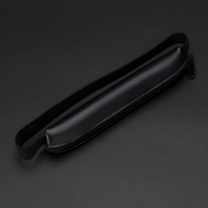 Long beige grey PU leather pencil case on a desk with pens