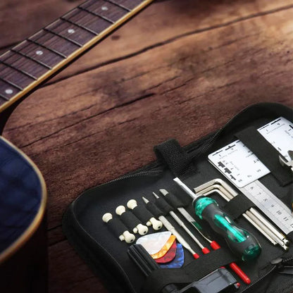 Black guitar repair kit case measuring 200x100x45mm containing metal and plastic tools for instrument maintenance