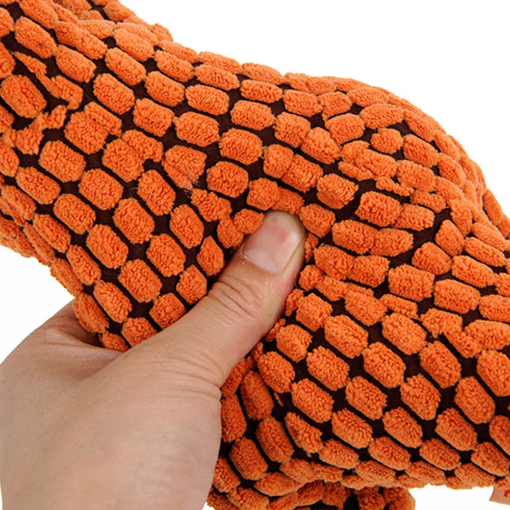 Durable dinosaur-shaped dog toys made of corn velvet and plush filling, available in multiple colors and sizes for large and small pets
