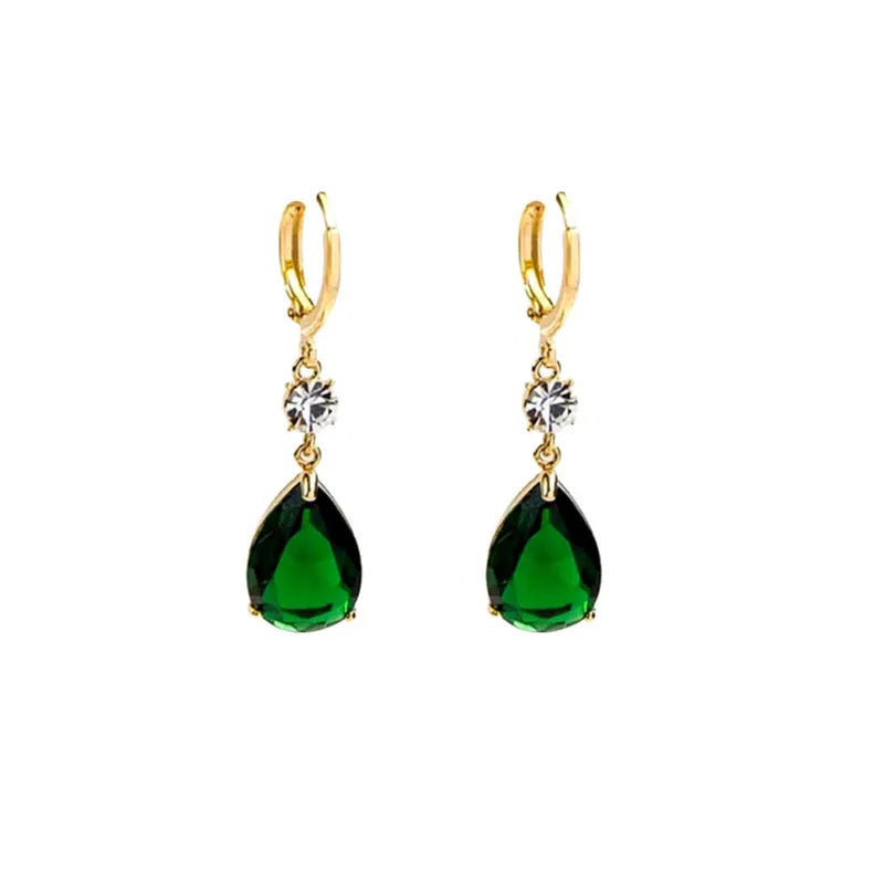 A pair of emerald green geometric teardrop drop earrings made from alloy