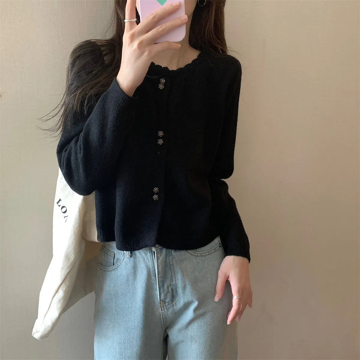 Women's milky white long sleeve acrylic cardigan sweater worn open, showing free size fit and regular sleeve design.