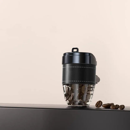 Solid coffee cup shaped car air freshener in plastic, shown in brown colour on a car dashboard.