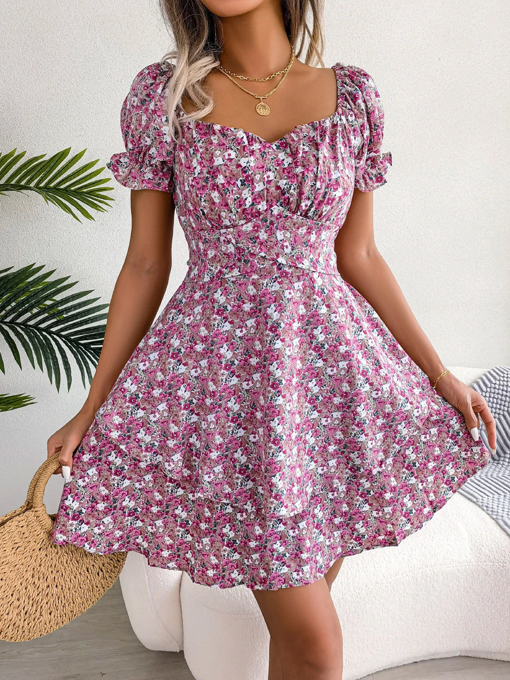 Stylish floral mini dress with ruffled skirt, high-waist design, and short sleeves for a flattering and comfortable summer look