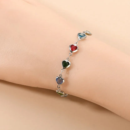 Devil's eye geometric heart bracelet in stainless steel showing colourful electroplated finish options.