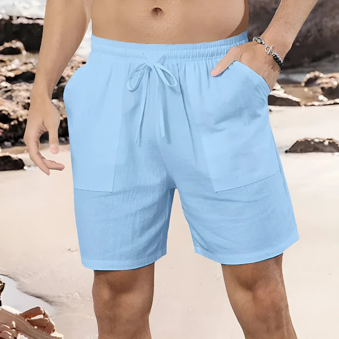 Men's light blue linen shorts with straight-leg cut on mannequin showing European sizing label