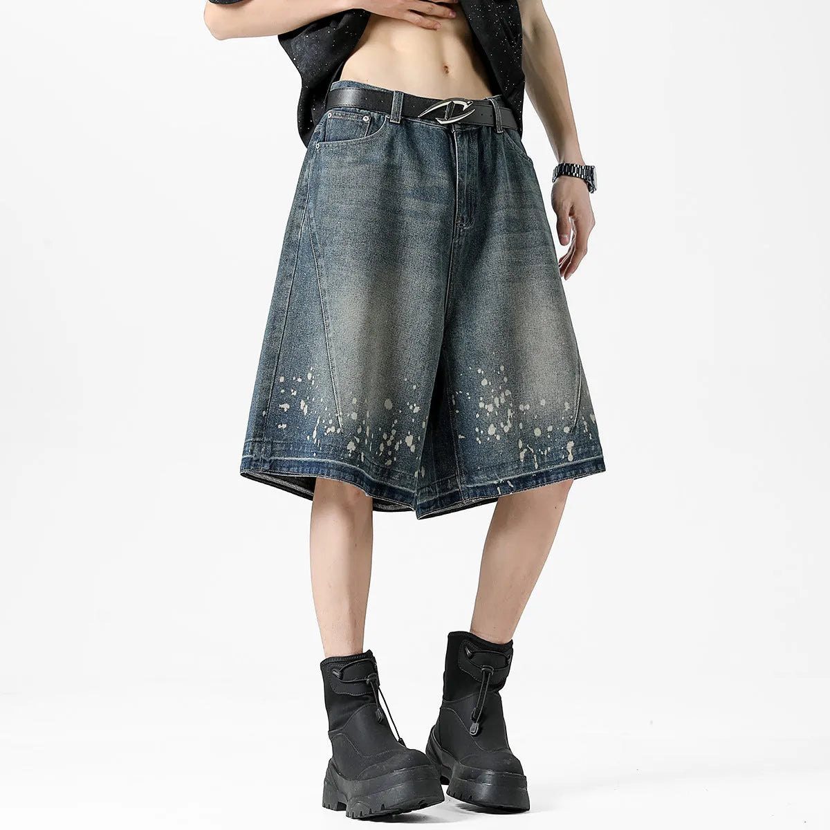 Men's retro blue denim shorts with ripped knees and splash ink detailing, straight leg mid-thigh cut.