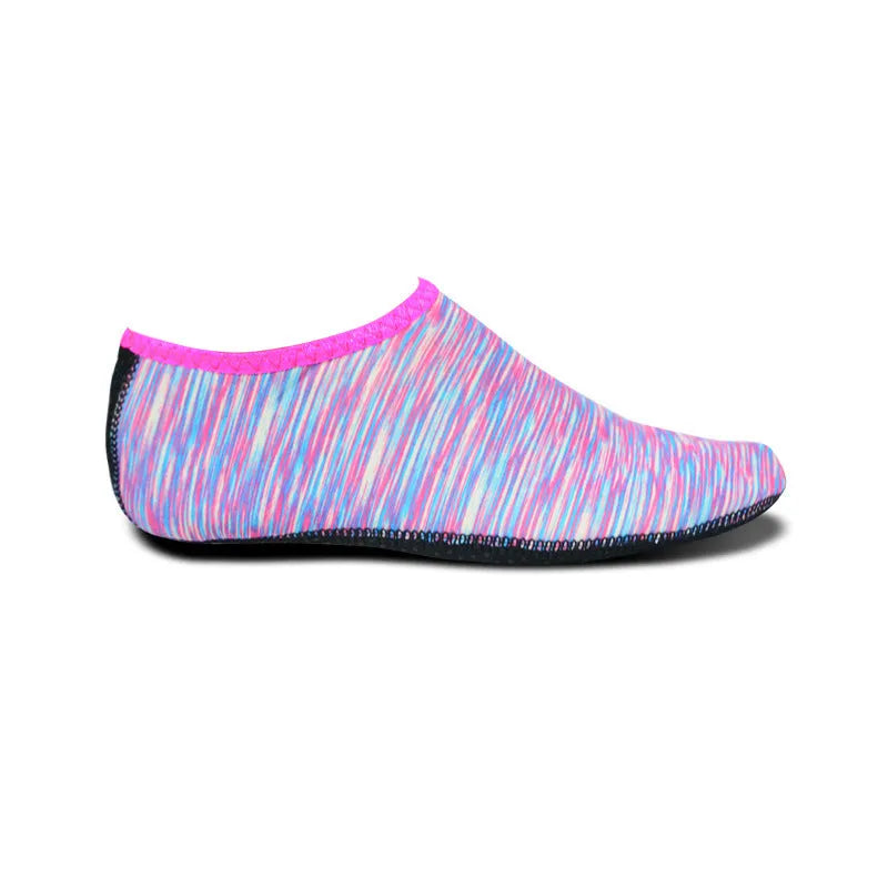 Pair of snorkeling diving socks in camouflage red, 2.5mm rubber and Lycra, non-slip sole, shown flat.